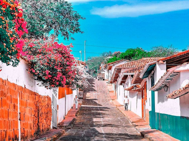 View of a colonial street in Barichara, lined with traditional houses
