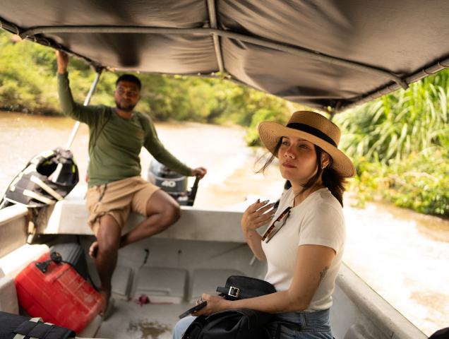 Visitors traveling by boat to the Kogui community in the Sierra Nevada de Santa Marta