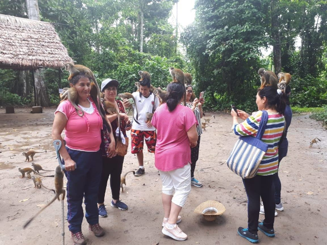 Visitors exploring Monkey Island in the Colombian Amazon.